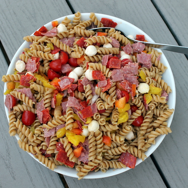 Italian Antipasto Pasta Salad - Books n' Cooks - Summer will be over before you know it. So, while the weather is still hot, get out and enjoy it as much as you can. We're helping you by sharing all our favorite picnic and cookout recipes. Hopefully, they'll inspire you to spend time with friends in the sun and enjoy the warm summer weather while it lasts.
