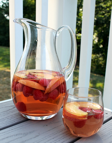 Peach Rose Sangria - Books n' Cooks - Summer will be over before you know it. So, while the weather is still hot, get out and enjoy it as much as you can. We're helping you by sharing all our favorite picnic and cookout recipes. Hopefully, they'll inspire you to spend time with friends in the sun and enjoy the warm summer weather while it lasts.