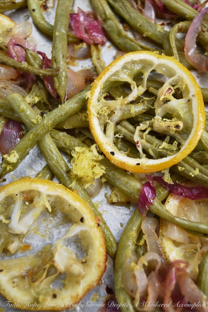 Lemony Summer Roasted Green Beans - It doesn't take much to make fresh summer green beans taste absolutely amazing. Roasting them is definitely the way to go. Topping them with a thinly sliced lemon while they are roasting and the zest and juice of yet another lemon after they are roasted helps to add lots of bright, tangy, and delicious lemony flavor.