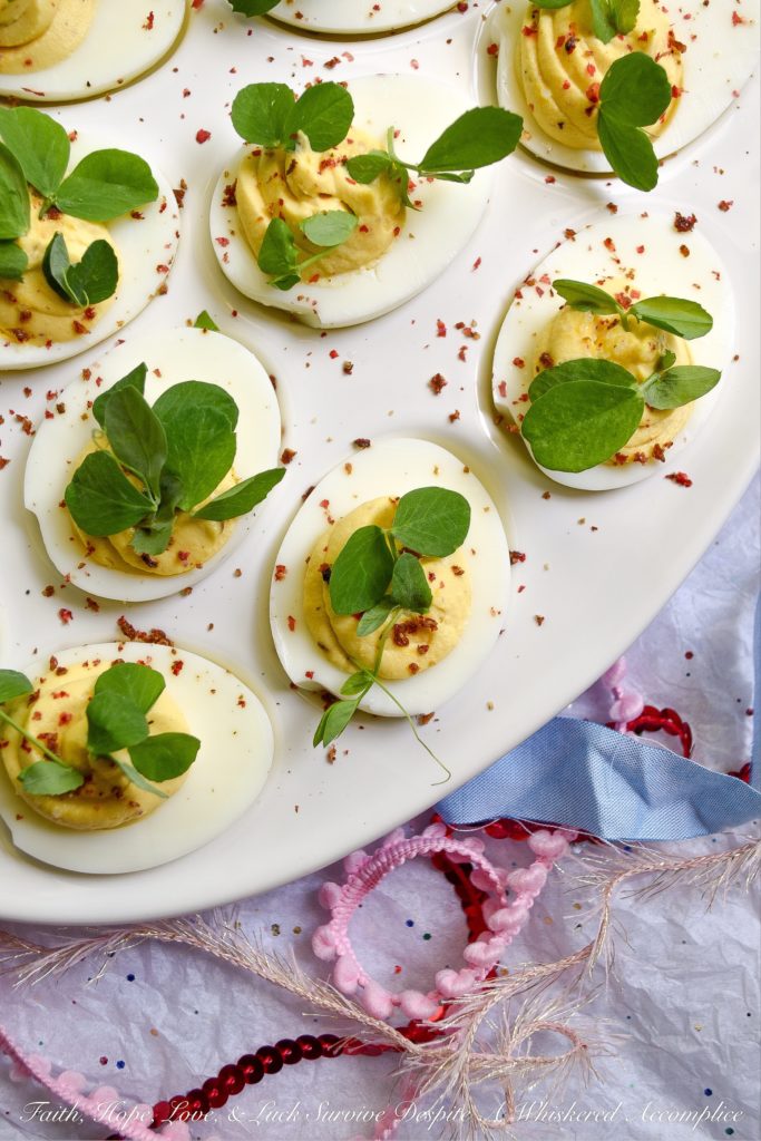 Deviled Eggs with Lemon & Pink Peppercorns - What can I say about these fabulous deviled eggs? They're traditional deviled eggs, only kicked up a notch. That's what happens when you add a hint of fresh lemon juice, lots of lemon zest, and just the right amount of finely ground pink peppercorns. These little deviled egg beauties are fresh, zingy, peppery, and just begging to be devoured.