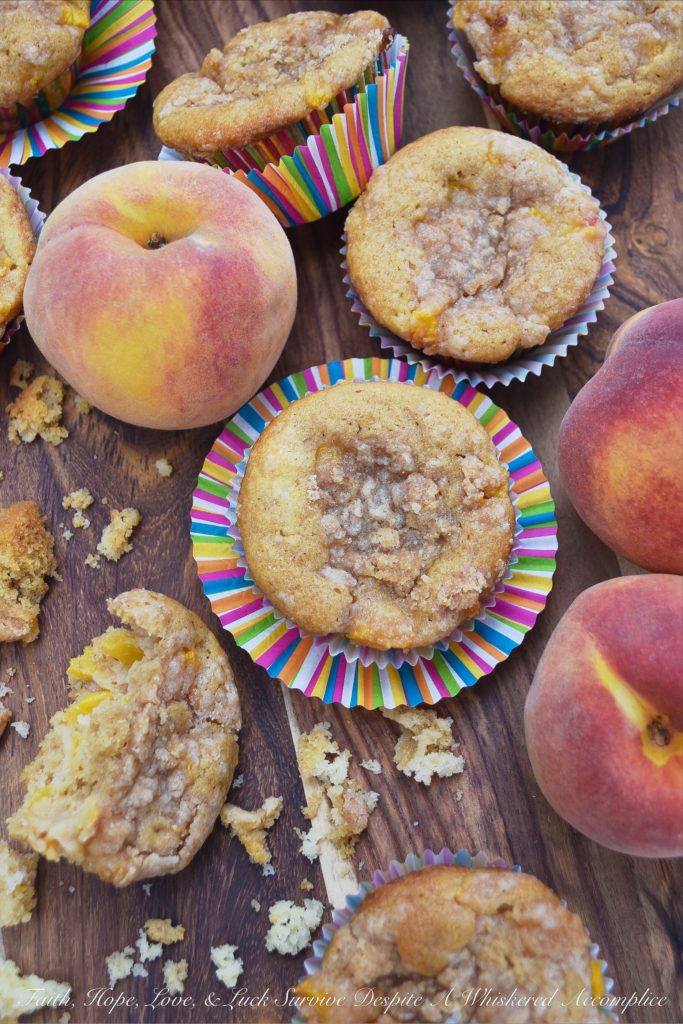 Peach Cobbler Muffins with Cinnamon Streusel - Can a muffin make you fall instantly in love? These peach cobbler muffins certainly can. Not only are they filled with fresh summer peaches, but they're also topped with them as well, making them super-moist, fluffy, and almost sinful. And, since they are also topped with a cinnamon streusel topping, you're pretty much guaranteed to fall head-over-heels in love at first bite.
