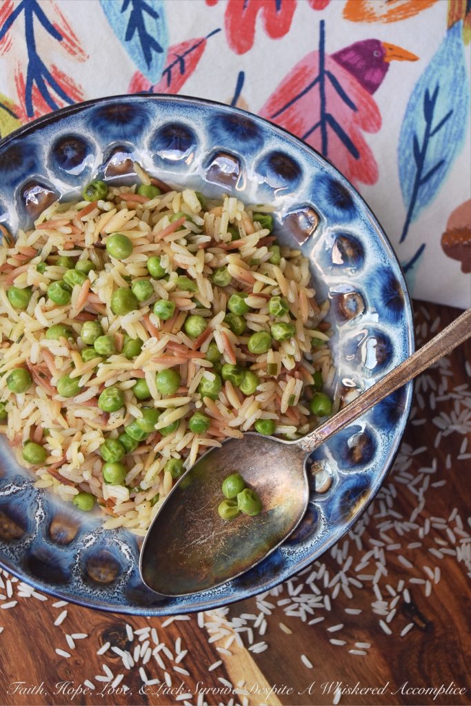 Weeknight Rice Pilaf with Peas & Chives - This delicious side dish is the perfect accompaniment to just about any busy weeknight meal. It takes less than 30 minutes to make, only requires a few minutes of stirring, and can be made using one pot or one pan. And since it also contains frozen peas, it will save you from having to make an additional vegetable side dish.