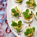 Deviled Eggs with Lemon & Pink Peppercorns - What can I say about these fabulous deviled eggs? They're traditional deviled eggs, only kicked up a notch. That's what happens when you add a hint of fresh lemon juice, lots of lemon zest, and just the right amount of finely ground pink peppercorns. These little deviled egg beauties are fresh, zingy, peppery, and just begging to be devoured.