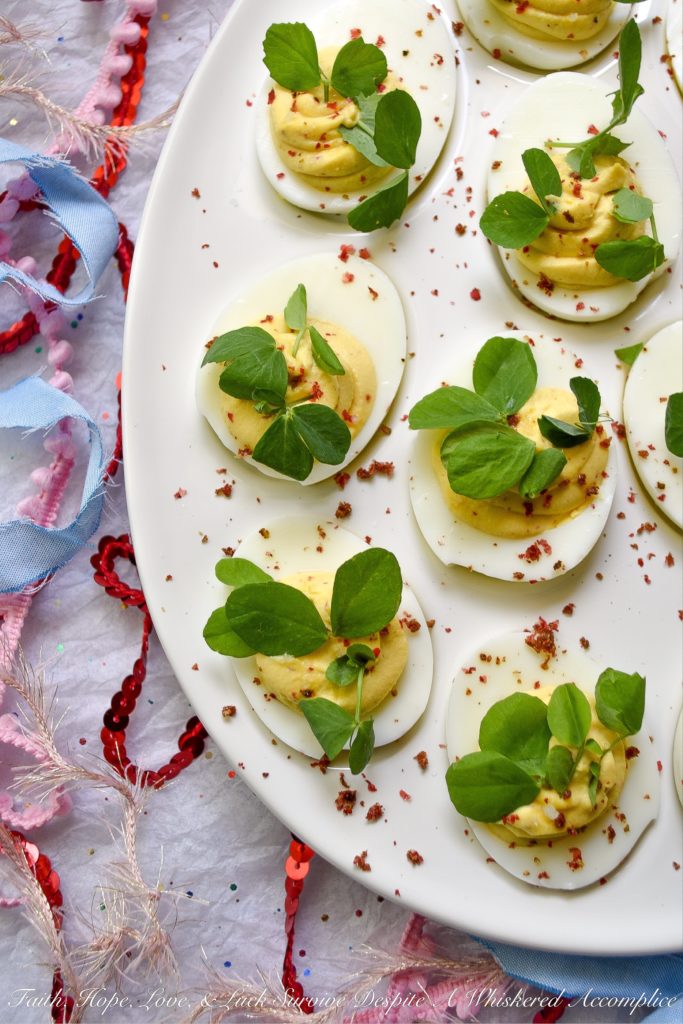 Deviled Eggs with Lemon & Pink Peppercorns - What can I say about these fabulous deviled eggs? They're traditional deviled eggs, only kicked up a notch. That's what happens when you add a hint of fresh lemon juice, lots of lemon zest, and just the right amount of finely ground pink peppercorns. These little deviled egg beauties are fresh, zingy, peppery, and just begging to be devoured.