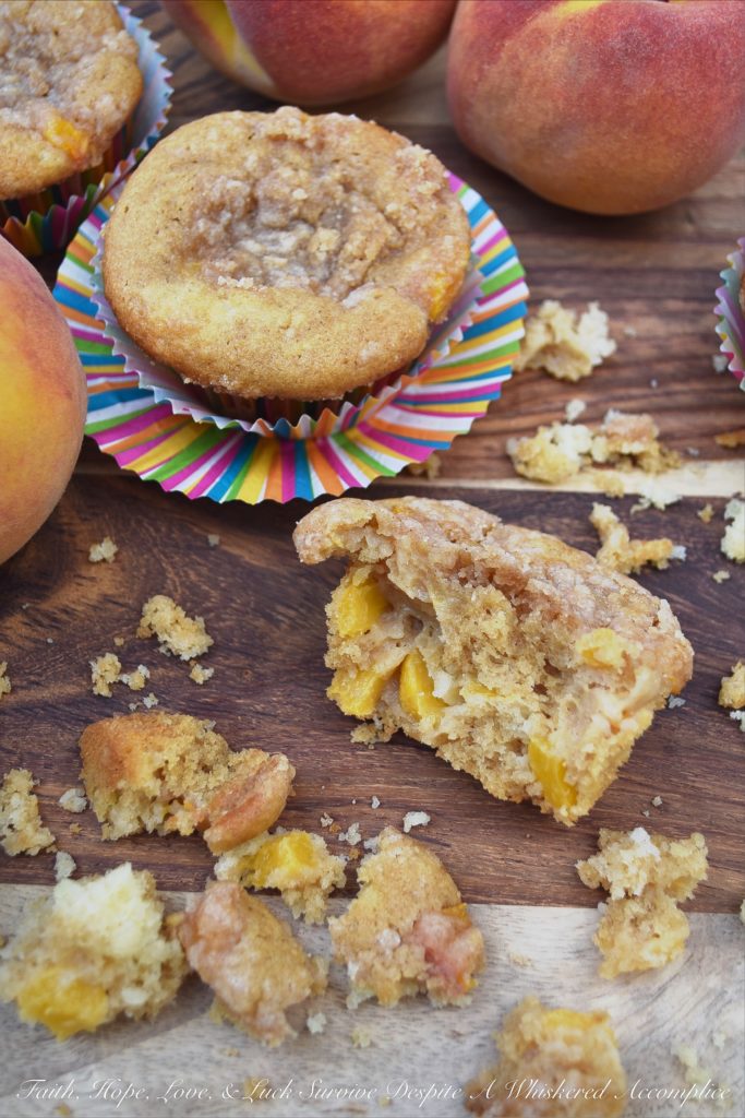 Peach Cobbler Muffins with Cinnamon Streusel - Can a muffin make you fall instantly in love? These peach cobbler muffins certainly can. Not only are they filled with fresh summer peaches, but they're also topped with them as well, making them super-moist, fluffy, and almost sinful. And, since they are also topped with a cinnamon streusel topping, you're pretty much guaranteed to fall head-over-heels in love at first bite.