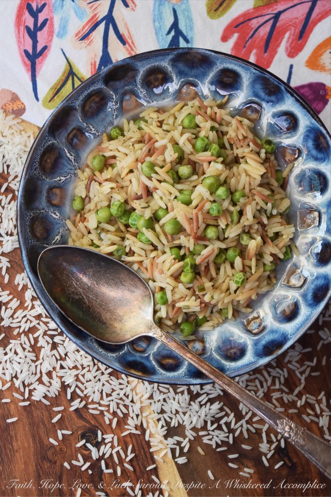 Weeknight Rice Pilaf with Peas & Chives - This delicious side dish is the perfect accompaniment to just about any busy weeknight meal. It takes less than 30 minutes to make, only requires a few minutes of stirring, and can be made using one pot or one pan. And since it also contains frozen peas, it will save you from having to make an additional vegetable side dish.