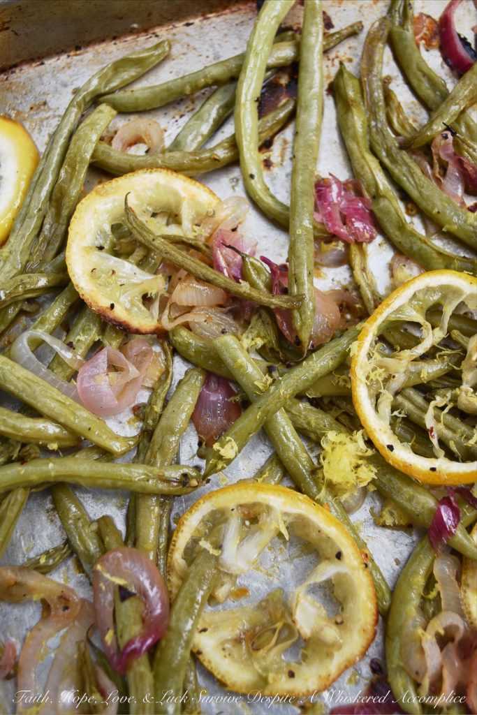 Lemony Summer Roasted Green Beans - It doesn't take much to make fresh summer green beans taste absolutely amazing. Roasting them is definitely the way to go. Topping them with a thinly sliced lemon while they are roasting and the zest and juice of yet another lemon after they are roasted helps to add lots of bright, tangy, and delicious lemony flavor.