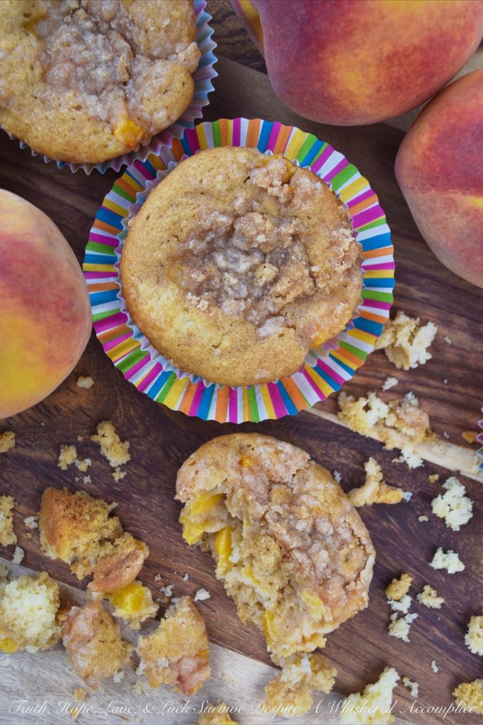 Peach Cobbler Muffins with Cinnamon Streusel - Can a muffin make you fall instantly in love? These peach cobbler muffins certainly can. Not only are they filled with fresh summer peaches, but they're also topped with them as well, making them super-moist, fluffy, and almost sinful. And, since they are also topped with a cinnamon streusel topping, you're pretty much guaranteed to fall head-over-heels in love at first bite.