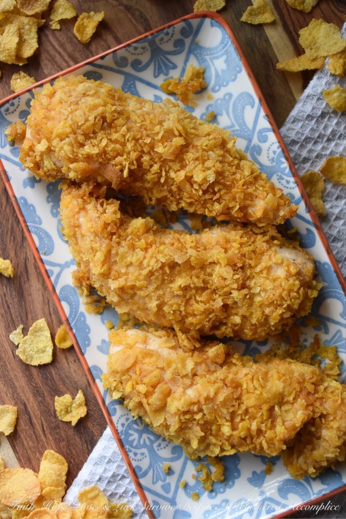 Crunchy Corn Flake Oven-Baked Chicken Tenders - Baking chicken on a busy weeknight doesn't get any easier than with these crunchy corn flake-coated chicken tenders. Assembly alone will take you a whopping five minutes and allow you the opportunity to take out some of your daily frustration when crushing the corn flakes. Add approximately 20 minutes of baking time and dinner is served. Now, was that so hard?