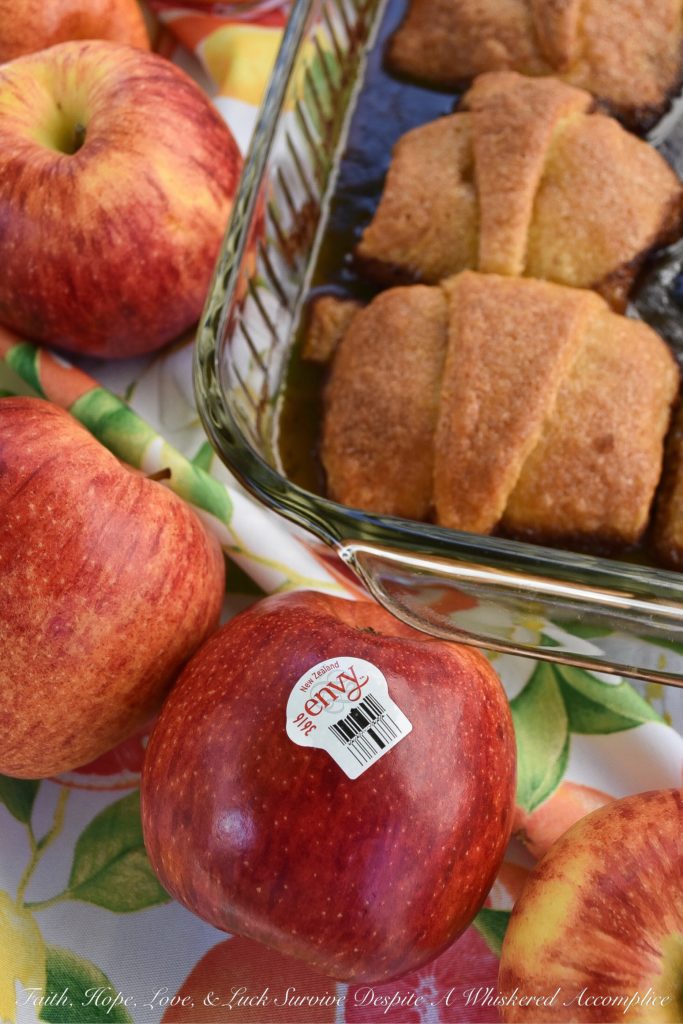 Soda-Glazed Crescent Roll Apple Dumplings - Apple dumplings are by far, one of the best fall desserts, however, they can be a little time-consuming to make. By using crescent rolls for the crust and brown soda or root beer to help make the sauce, you can save time and still have an amazing, apple-filled treat for dessert. Simply put, these sweet crescent roll apple dumplings are dangerously delicious.