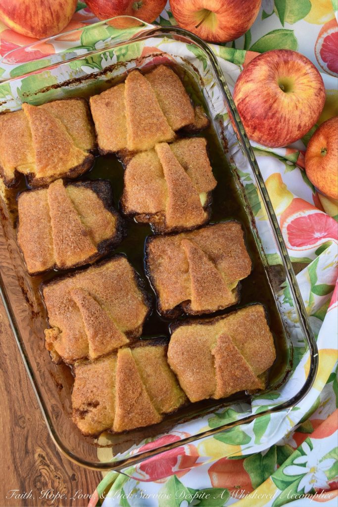 Soda-Glazed Crescent Roll Apple Dumplings - Apple dumplings are by far, one of the best fall desserts, however, they can be a little time-consuming to make. By using crescent rolls for the crust and brown soda or root beer to help make the sauce, you can save time and still have an amazing, apple-filled treat for dessert. Simply put, these sweet crescent roll apple dumplings are dangerously delicious.