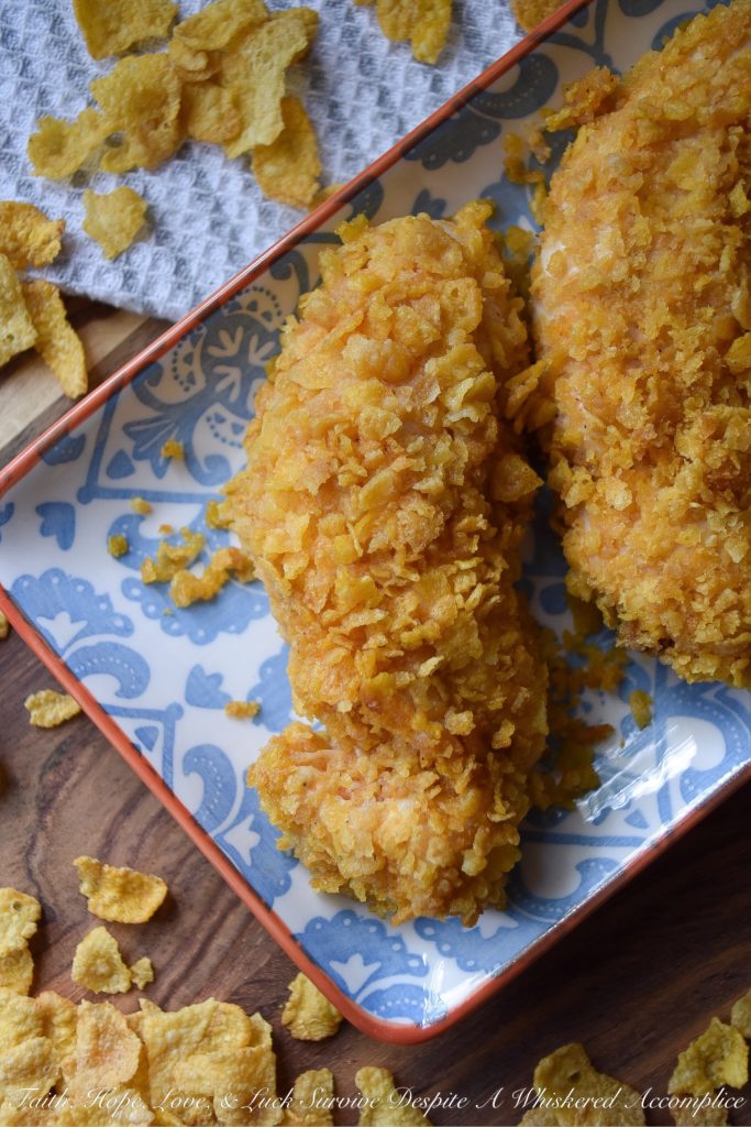 Crunchy Corn Flake Oven-Baked Chicken Tenders - Baking chicken on a busy weeknight doesn't get any easier than with these crunchy corn flake-coated chicken tenders. Assembly alone will take you a whopping five minutes and allow you the opportunity to take out some of your daily frustration when crushing the corn flakes. Add approximately 20 minutes of baking time and dinner is served. Now, was that so hard?