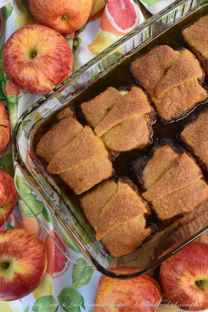 Soda-Glazed Crescent Roll Apple Dumplings - Apple dumplings are by far, one of the best fall desserts, however, they can be a little time-consuming to make. By using crescent rolls for the crust and brown soda or root beer to help make the sauce, you can save time and still have an amazing, apple-filled treat for dessert. Simply put, these sweet crescent roll apple dumplings are dangerously delicious.