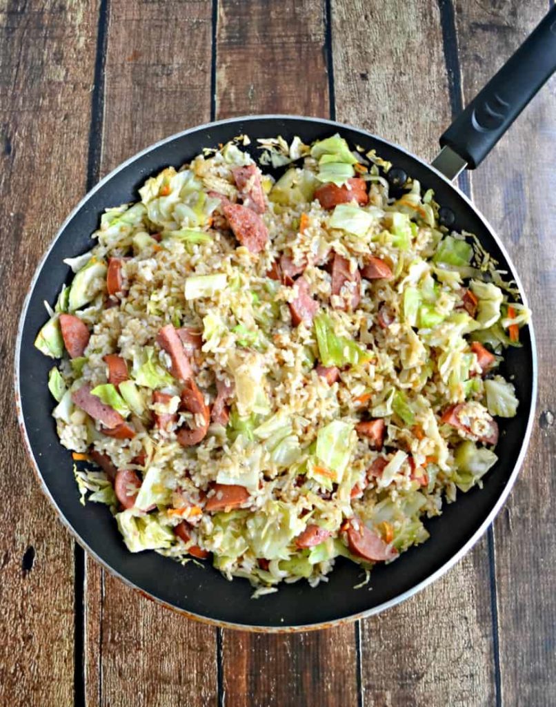 Kielbasa and Cabbage Skillet with Buttered Rice - Hezzi-D's Books and Cooks - Welcome to Friday! Friday! Friday! Favorites! Each Friday we'll be sharing our favorite recipes of the week from other fabulous food bloggers, so make sure to visit and see what tasty over-the-top dishes we're most excited about.