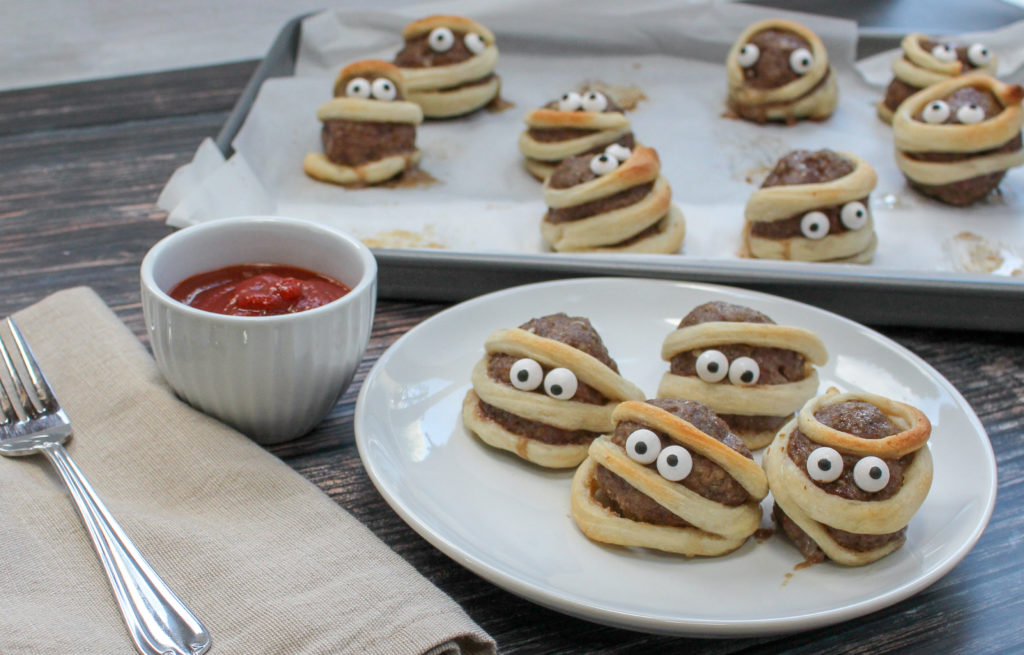 Mummy Meatballs - Cheese Curd In Paradise - October 2019 Recipe Round-Up - Now that it's fall and Halloween's right around the corner, we're all looking for a few cute recipes to celebrate the autumn season with. This month's October recipe round-up is packed with tons of spooky sweet and savory recipes to help you and your little goblins get in the holiday spirit.