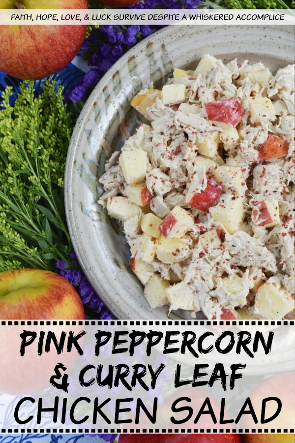 Pink Peppercorn & Curry Leaf Chicken Salad - Pink peppercorns and dried curry leaves bring a unique and subtle flavor to this pink peppercorn and curry leaf autumn chicken salad. To start with, the chicken is poached in seasoned water inside of a crockpot or slow cooker, to ensure that it is moist and extra flavorful. Then, it is gently tossed into a mayonnaise and apple cider vinegar mixture along with crunchy fall apples and additional pink peppercorns.