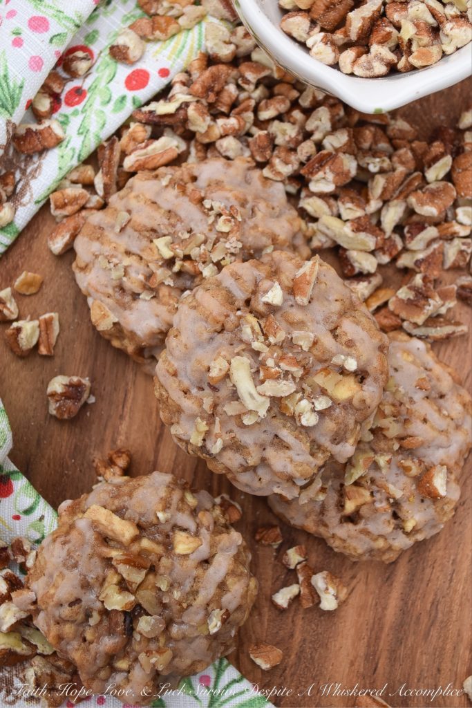 Soft Cinnamon Apple Pecan Cookies - Every holiday cookie platter needs a nutty cookie to make it complete. This apple and pecan cinnamon iced cookie is that cookie. If you like soft, sweet, crunchy, fruity, cinnamon packed Christmas cookies, this is one recipe you're absolutely going to love.