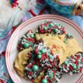 Chocolate-Dipped Christmas Butter Cookies - What's better than a holiday butter cookie? A festive Christmas holiday butter cookie dipped in chocolate and covered with sprinkles. Yup, chocolate-dipped butter cookies definitely make the holidays worth celebrating.
