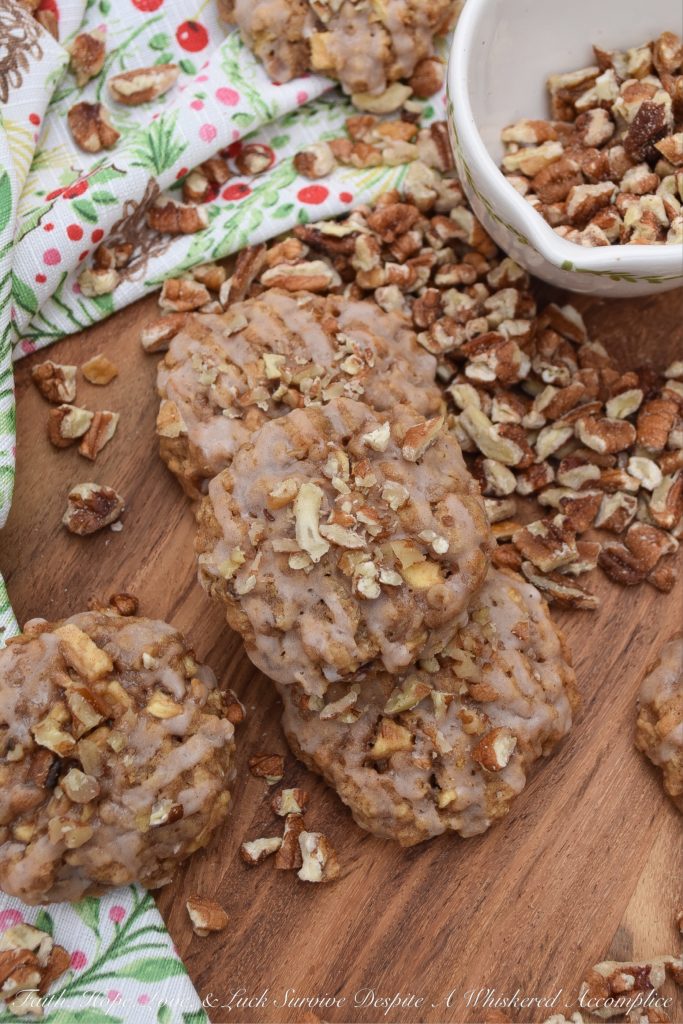 Soft Cinnamon Apple Pecan Cookies - Every holiday cookie platter needs a nutty cookie to make it complete. This apple and pecan cinnamon iced cookie is that cookie. If you like soft, sweet, crunchy, fruity, cinnamon packed Christmas cookies, this is one recipe you're absolutely going to love.