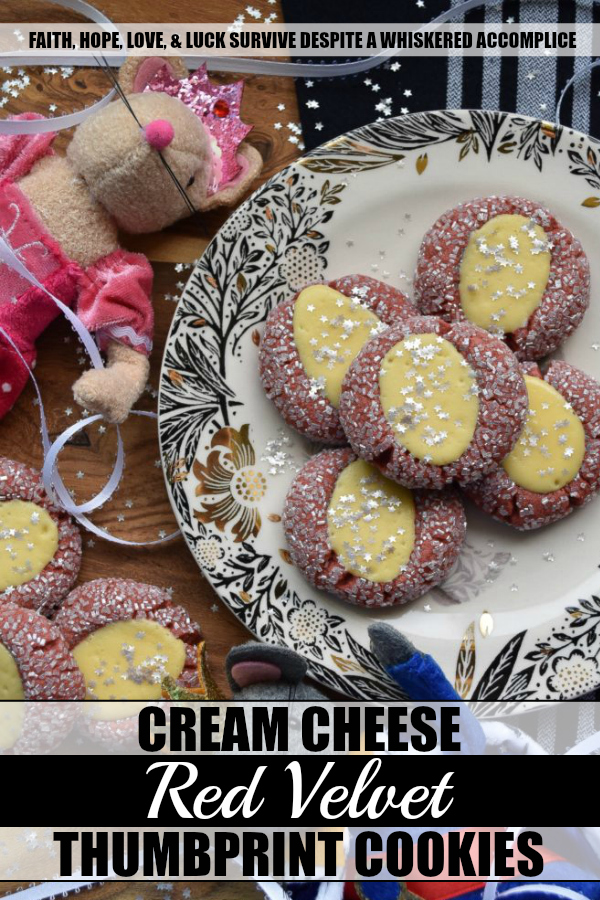 Cream Cheese Red Velvet Thumbprint Cookies - These festive sugar-coated thumbprint cookies are the perfect Christmas cookie, thanks to their red color and shimmery appearance. And, after being filled with a cream cheese filling, they're just as delicious as they are beautiful.