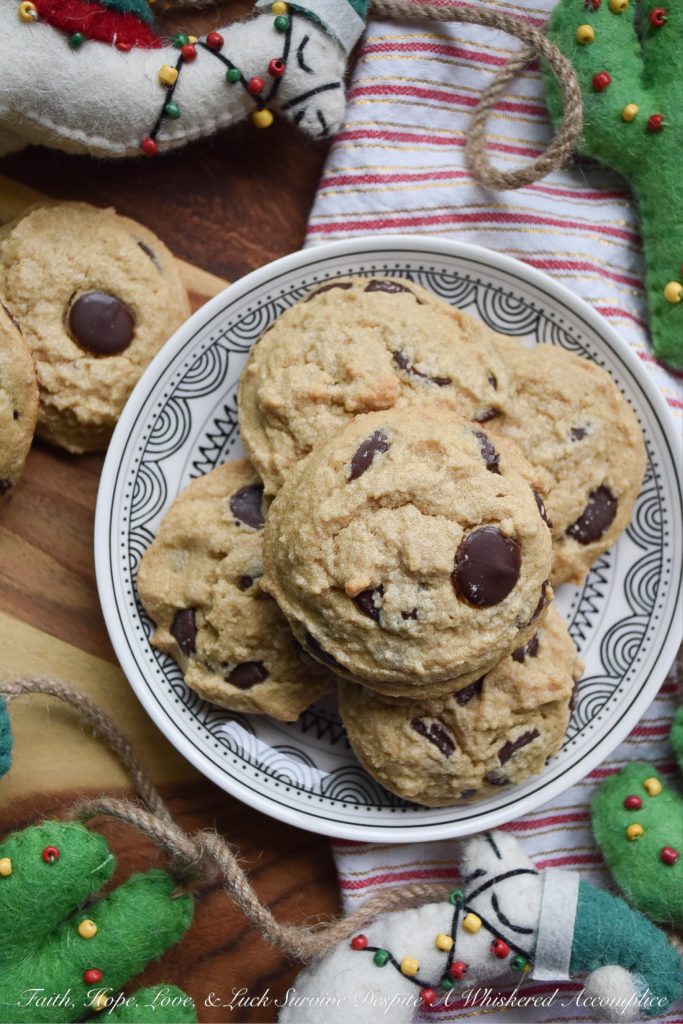 Crumbly Gluten-Free Chocolate Chip Cookies - Two ingredients give these gluten-free chocolate chip cookies their amazing crumbly texture; peanut butter and corn starch. And thanks to the healthy dose of chocolate chips in these crumbly cookies, I can pretty much promise, that once you have one, you're definitely going to want another. So, grab a glass of milk and a cookie or two, it's time to enjoy this sweet gluten-free treat.
