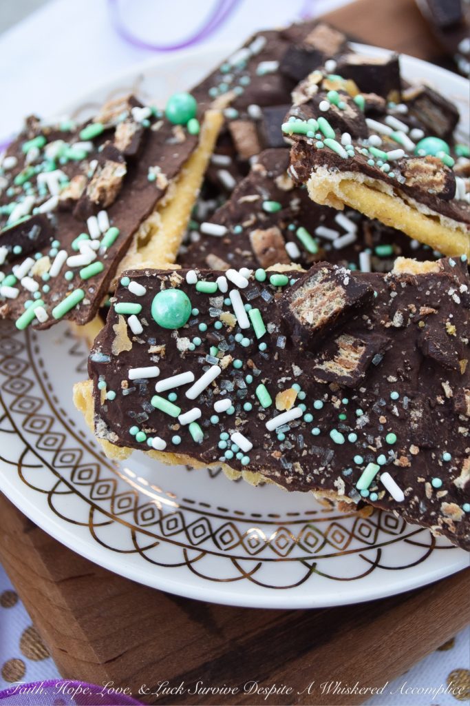 Saltine Cracker Candy Topped with Kit Kat Bars - Cracker candy, made with saltine crackers, is probably one of the most delicious sweet treats imaginable. However, when you generously top it with sprinkles and roughly chopped Kit Kat candy bars, it becomes even more amazing.