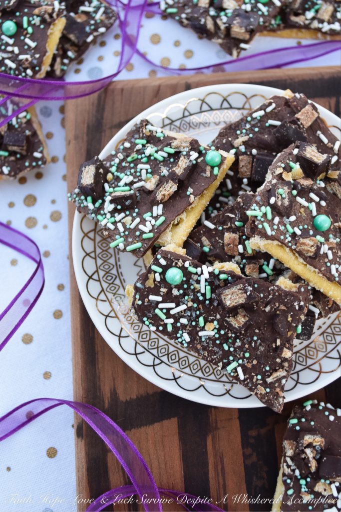 Saltine Cracker Candy Topped with Kit Kat Bars - Cracker candy, made with saltine crackers, is probably one of the most delicious sweet treats imaginable. However, when you generously top it with sprinkles and roughly chopped Kit Kat candy bars, it becomes even more amazing.