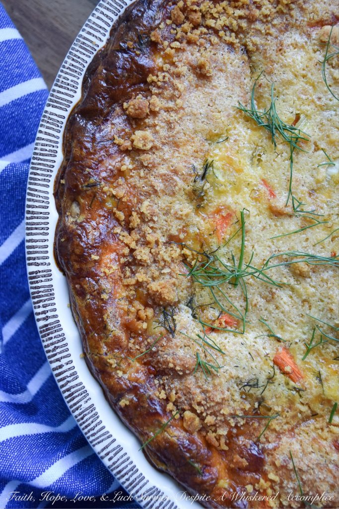 Cracker Crumb Topped Fennel & Carrot Quiche - From a sun-drenched weekend brunch to a quick, satisfying lunch, or even a cozy weeknight dinner, this veggie-loaded quiche effortlessly adapts to your needs. Imagine a golden, savory pie crust filled with the subtle anise notes of flavorful fennel, bright, sweet carrots, and the nutty, creamy tang of melted Gouda cheese, all crowned with an irresistible, crispy cracker crumb topping. Be prepared, this is one quiche recipe that will have your entire family begging for seconds.