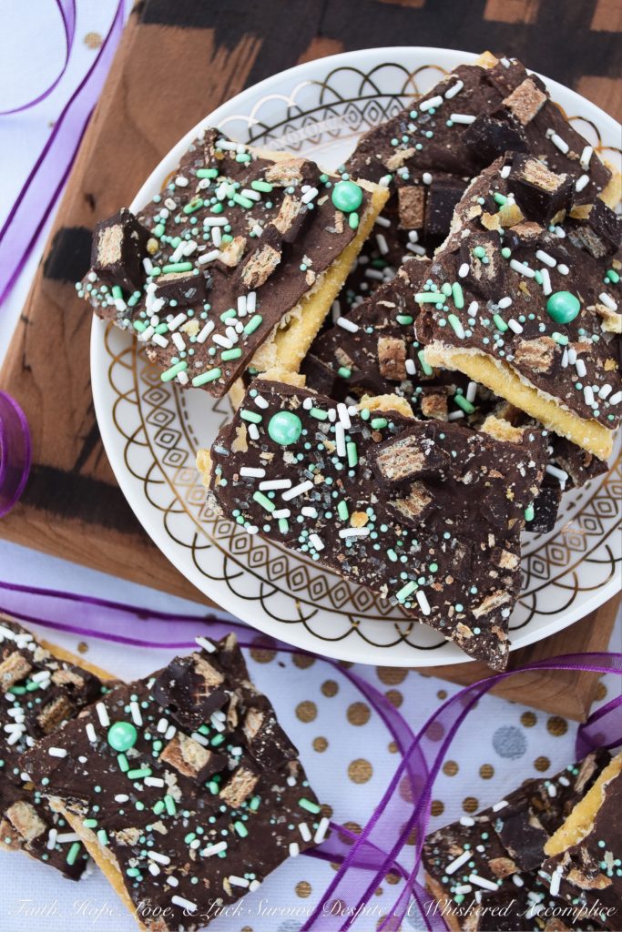 Saltine Cracker Candy Topped with Kit Kat Bars - Cracker candy, made with saltine crackers, is probably one of the most delicious sweet treats imaginable. However, when you generously top it with sprinkles and roughly chopped Kit Kat candy bars, it becomes even more amazing.