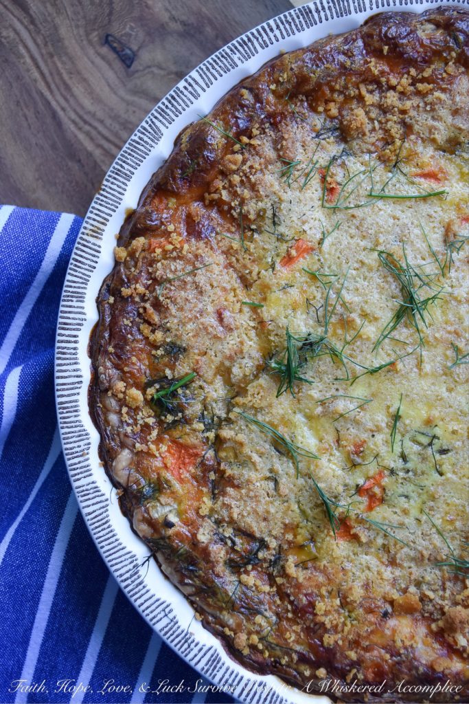 Cracker Crumb Topped Fennel & Carrot Quiche - From a sun-drenched weekend brunch to a quick, satisfying lunch, or even a cozy weeknight dinner, this veggie-loaded quiche effortlessly adapts to your needs. Imagine a golden, savory pie crust filled with the subtle anise notes of flavorful fennel, bright, sweet carrots, and the nutty, creamy tang of melted Gouda cheese, all crowned with an irresistible, crispy cracker crumb topping. Be prepared, this is one quiche recipe that will have your entire family begging for seconds.