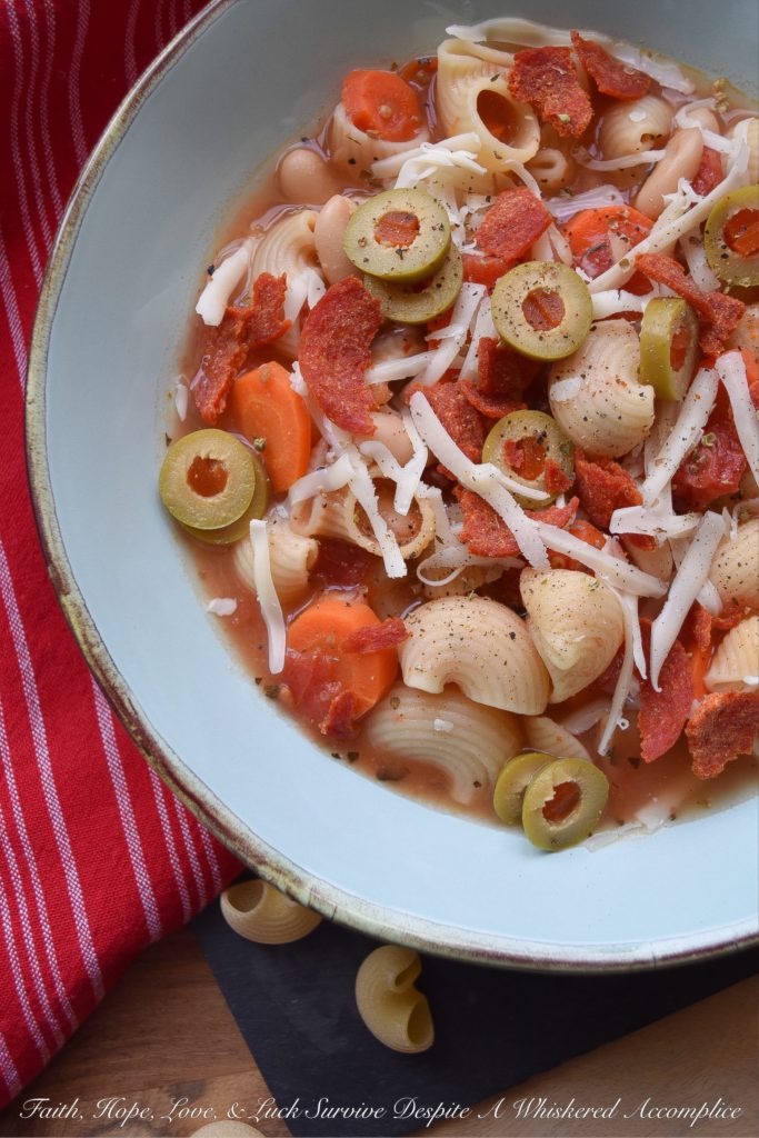30-Minute Pepperoni Pizza Minestrone Soup - Everyone loves pizza for dinner, however, on a busy weeknight, it's nice to not have to worry about waiting for one to be delivered to your house. This quick 30-minute minestrone soup has all of the flavors of a pizza, using simple ingredients you have in your fridge and in your pantry. It's a fast, delicious, and flavorful weeknight meal, without the need for delivery. And, there are a few vegetables thrown in for extra nutrition.
