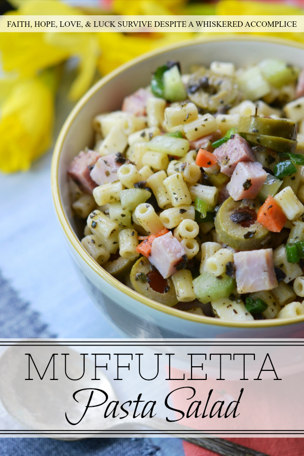 Muffuletta Pasta Salad - This amazingly flavorful muffuletta pasta salad has all of the good stuff in it, including ham, genoa salami, provolone cheese, celery, carrots, scallions, and lots and lots of green olives. It's definitely anything but bland, and I'm willing to bet that it may just become your new go-to pasta salad recipe.
