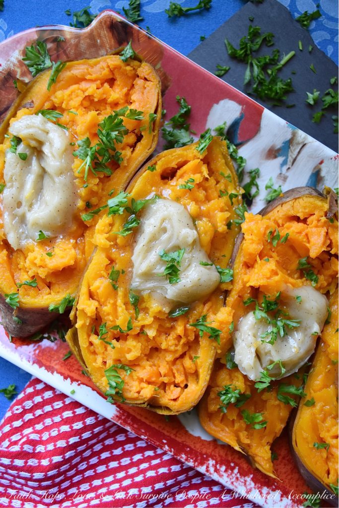 Maple & Honey Butter Crockpot Sweet Potatoes - After making sweet potatoes in a crockpot or slow cooker, you may never make them any other way. They are perfectly tender and ready to top with your favorite fixings after only six hands-off hours of slow cooking. In this simple recipe, these sweet potatoes are topped with a sweet and flavorful homemade butter infused with maple and butter.