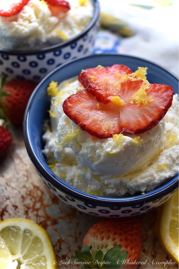 Lemon Cheesecake Ice Cream with Strawberries - You're just seven ingredients away from the best lemony cheesecake ice cream you've ever tasted. The secret? Fresh lemon juice and zest, heavy whipping cream, cream cheese, sugar, vanilla, and a touch of salt. And, to top things off, a few freshly sliced strawberries. Because every lemony dessert tastes just a little bit better with fresh fruit, am I right?
