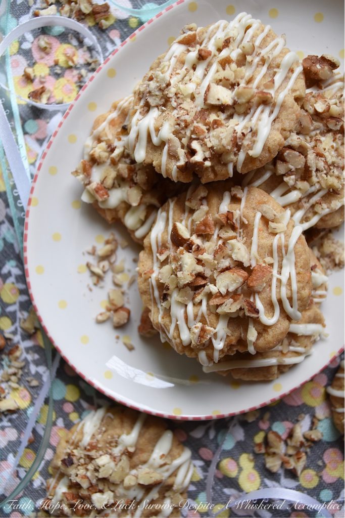 White Chocolate Carrot Cake Tea Cookies - Nothing says spring more than carrot cake. It's one dessert that seems to pop up every year when the trees begin to bloom and Easter approaches. This year, instead of making a traditional carrot cake, try making these tea cookies instead. These cookies are a convenient single-serving dessert with all of the cinnamon, pecan, and white chocolate flavors you've come to love.