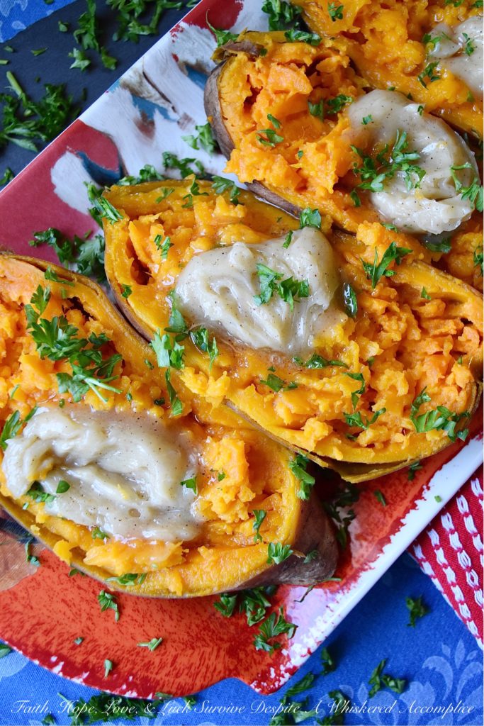 Maple & Honey Butter Crockpot Sweet Potatoes - After making sweet potatoes in a crockpot or slow cooker, you may never make them any other way. They are perfectly tender and ready to top with your favorite fixings after only six hands-off hours of slow cooking. In this simple recipe, these sweet potatoes are topped with a sweet and flavorful homemade butter infused with maple and butter.