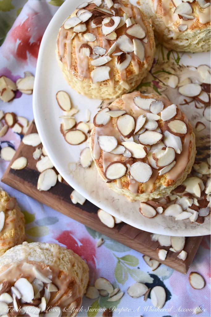 Baileys Irish Cream Almond Scones - A little bit of Baileys Irish Cream and a few sliced almonds give these traditional English scones an extra delicious dose of flavor. It won't matter what time of day you choose to enjoy them, they're a sweet boozy treat you'll always enjoy, whether it be for breakfast, tea, or dessert.