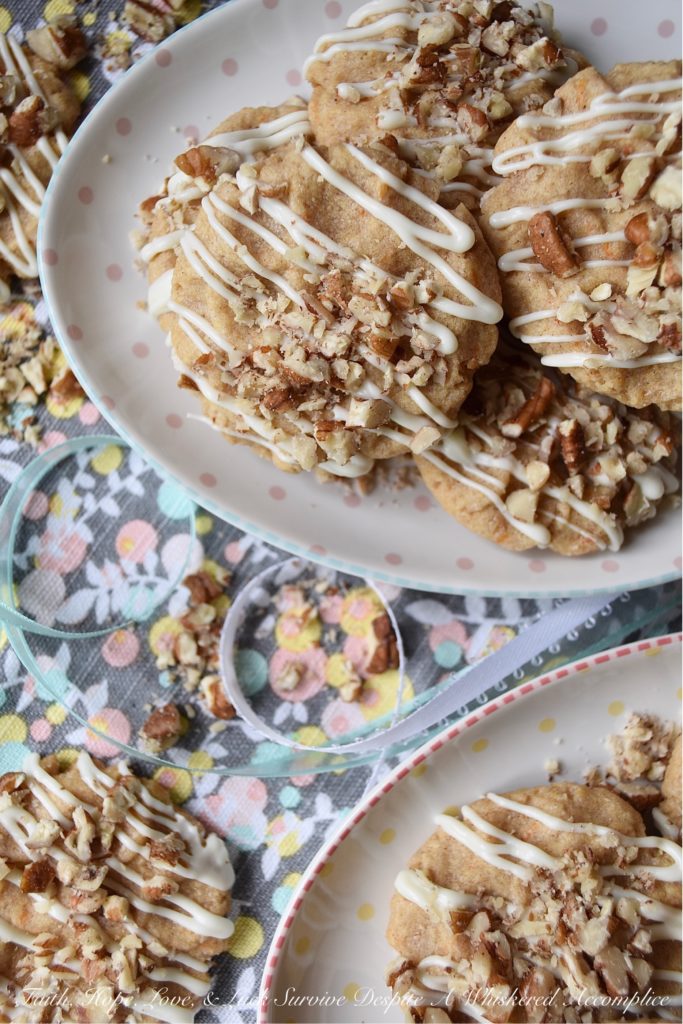 White Chocolate Carrot Cake Tea Cookies - Nothing says spring more than carrot cake. It's one dessert that seems to pop up every year when the trees begin to bloom and Easter approaches. This year, instead of making a traditional carrot cake, try making these tea cookies instead. These cookies are a convenient single-serving dessert with all of the cinnamon, pecan, and white chocolate flavors you've come to love.