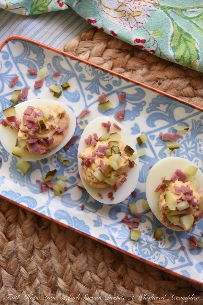 Corned Beef (Lunch Meat) Irish Deviled Eggs - Deviled eggs aren't just for Easter. These particular ones are for St. Patrick's Day. A little bit of seasoning, a few dill pickles, and a wee bit of very finely chopped corned beef lunch meat definitely help give these traditional deviled eggs an Irish flair. They're so fantastic, you may just decide that they don't even require a holiday to enjoy them.
