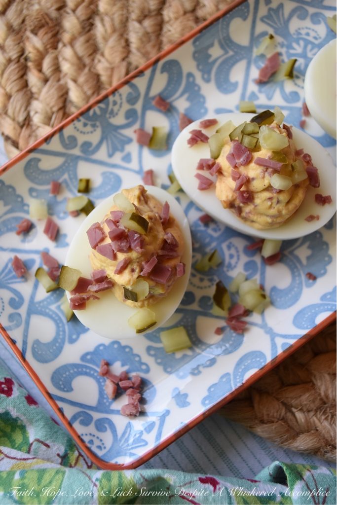 Corned Beef (Lunch Meat) Irish Deviled Eggs - Deviled eggs aren't just for Easter. These particular ones are for St. Patrick's Day. A little bit of seasoning, a few dill pickles, and a wee bit of very finely chopped corned beef lunch meat definitely help give these traditional deviled eggs an Irish flair. They're so fantastic, you may just decide that they don't even require a holiday to enjoy them.
