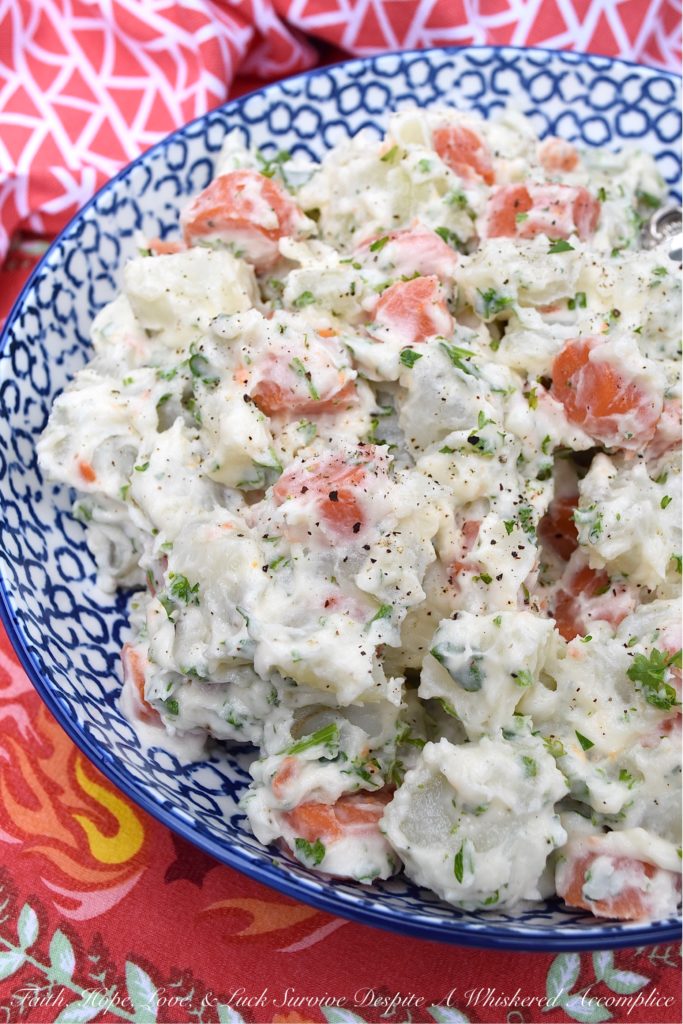 Creamy Potato Salad with Carrots & Parsley - This creamy potato salad is quite simple and doesn't require a whole lot of ingredients, however, it still manages to be packed with tons of flavor. Boiled, peeled and sliced carrots are what helps to make this side dish just so unique. They add gorgeous color and a slightly sweet flavor, which pairs so nicely with the fresh parsley and boiled red potatoes this summer recipe contains.