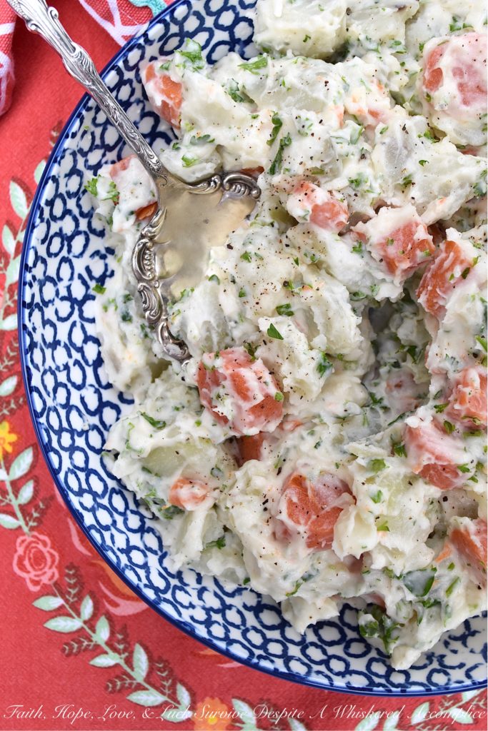 Creamy Potato Salad with Carrots & Parsley - This creamy potato salad is quite simple and doesn't require a whole lot of ingredients, however, it still manages to be packed with tons of flavor. Boiled, peeled and sliced carrots are what helps to make this side dish just so unique. They add gorgeous color and a slightly sweet flavor, which pairs so nicely with the fresh parsley and boiled red potatoes this summer recipe contains.