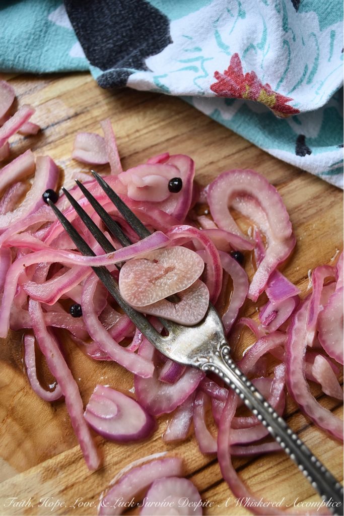 Lime & Beer Pickled Red Onions - Lime and beer, two very simple ingredients. But, when you add them to a very thinly sliced red onion, something absolutely magical happens. You can't help but love these sweet vinegary beer-infused onions. Serve them with your favorite Mexican dishes, such as tacos, quesadillas, fajitas, or even just choose to enjoy them by themselves. No matter how they're served, you're sure to love them.