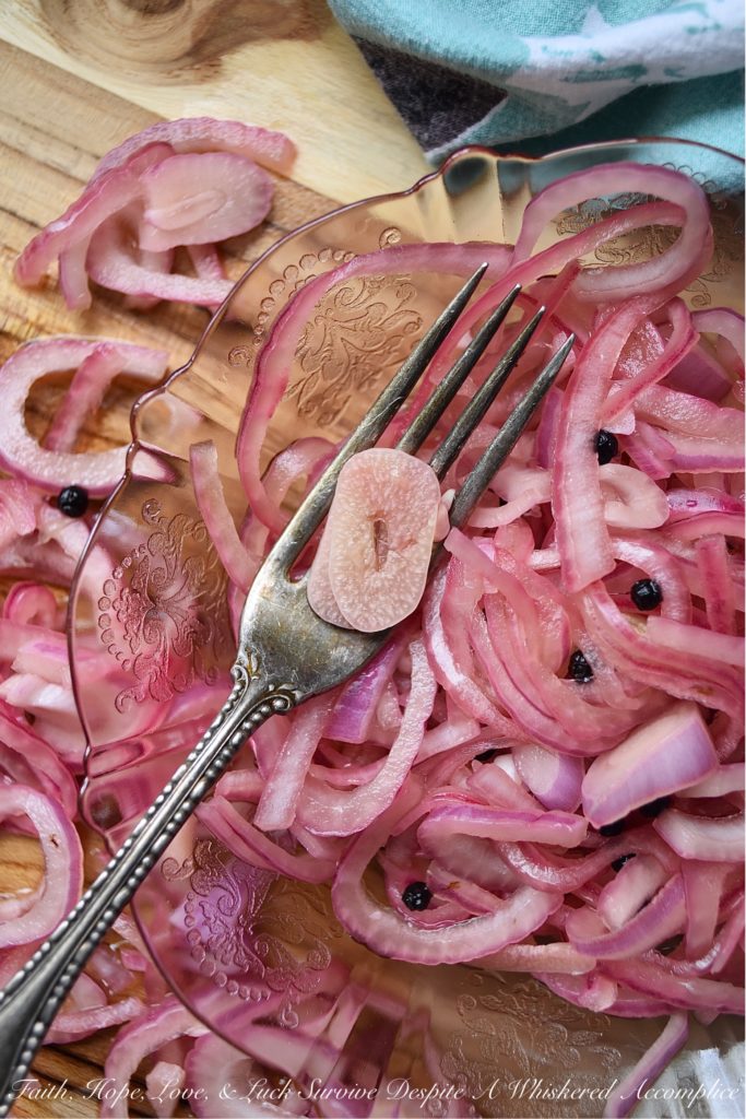 Lime & Beer Pickled Red Onions - Lime and beer, two very simple ingredients. But, when you add them to a very thinly sliced red onion, something absolutely magical happens. You can't help but love these sweet vinegary beer-infused onions. Serve them with your favorite Mexican dishes, such as tacos, quesadillas, fajitas, or even just choose to enjoy them by themselves. No matter how they're served, you're sure to love them.