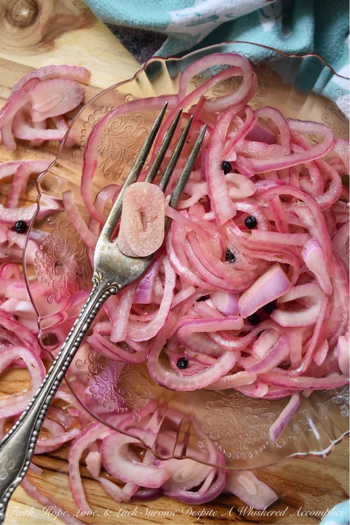 Lime & Beer Pickled Red Onions - Lime and beer, two very simple ingredients. But, when you add them to a very thinly sliced red onion, something absolutely magical happens. You can't help but love these sweet vinegary beer-infused onions. Serve them with your favorite Mexican dishes, such as tacos, quesadillas, fajitas, or even just choose to enjoy them by themselves. No matter how they're served, you're sure to love them.