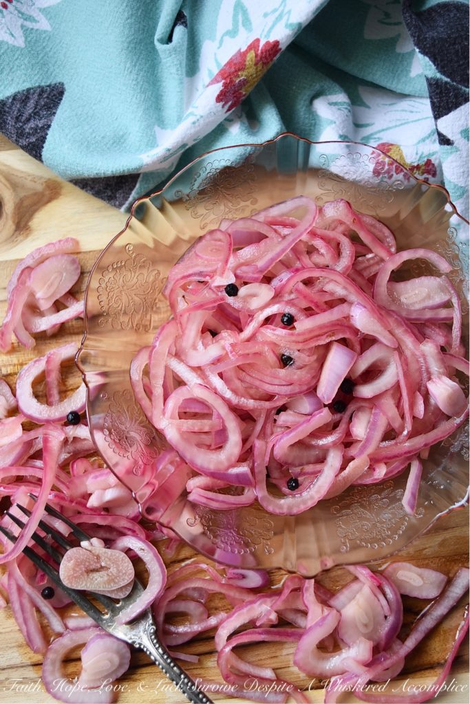 Lime & Beer Pickled Red Onions - Lime and beer, two very simple ingredients. But, when you add them to a very thinly sliced red onion, something absolutely magical happens. You can't help but love these sweet vinegary beer-infused onions. Serve them with your favorite Mexican dishes, such as tacos, quesadillas, fajitas, or even just choose to enjoy them by themselves. No matter how they're served, you're sure to love them.