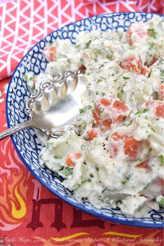 Creamy Potato Salad with Carrots & Parsley - This creamy potato salad is quite simple and doesn't require a whole lot of ingredients, however, it still manages to be packed with tons of flavor. Boiled, peeled and sliced carrots are what helps to make this side dish just so unique. They add gorgeous color and a slightly sweet flavor, which pairs so nicely with the fresh parsley and boiled red potatoes this summer recipe contains.