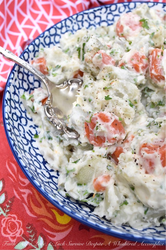 Creamy Potato Salad with Carrots & Parsley - This creamy potato salad is quite simple and doesn't require a whole lot of ingredients, however, it still manages to be packed with tons of flavor. Boiled, peeled and sliced carrots are what helps to make this side dish just so unique. They add gorgeous color and a slightly sweet flavor, which pairs so nicely with the fresh parsley and boiled red potatoes this summer recipe contains.
