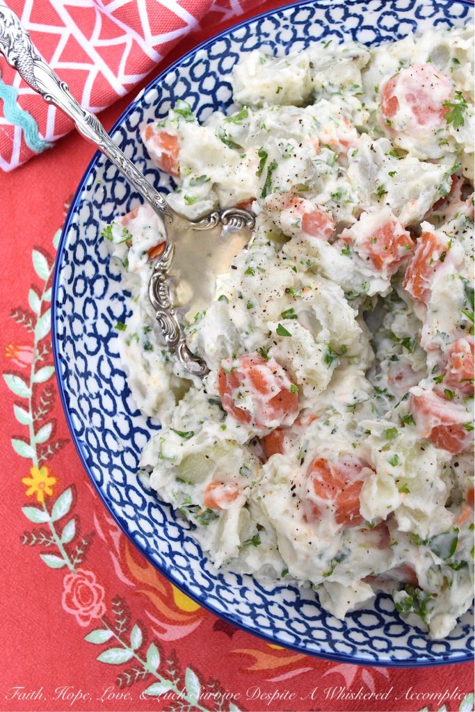 Creamy Potato Salad with Carrots & Parsley - This creamy potato salad is quite simple and doesn't require a whole lot of ingredients, however, it still manages to be packed with tons of flavor. Boiled, peeled and sliced carrots are what helps to make this side dish just so unique. They add gorgeous color and a slightly sweet flavor, which pairs so nicely with the fresh parsley and boiled red potatoes this summer recipe contains.