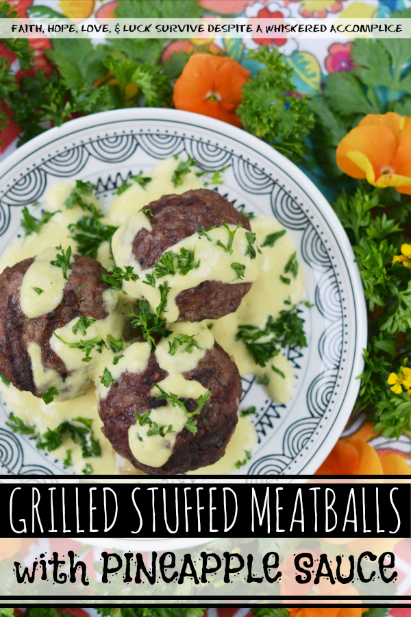 Grilled Stuffed Meatballs with Pineapple Sauce - It's always nice to have an alternative to the standard grilled hamburger during the summer months. These cheese-stuffed meatballs are seasoned with steak seasoning, grilled, and then served with a sweet pineapple sauce made out of fresh pineapple, mayonnaise, and dijon mustard.